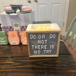Scentsy warmer and six scentsy waxes are still in boxes